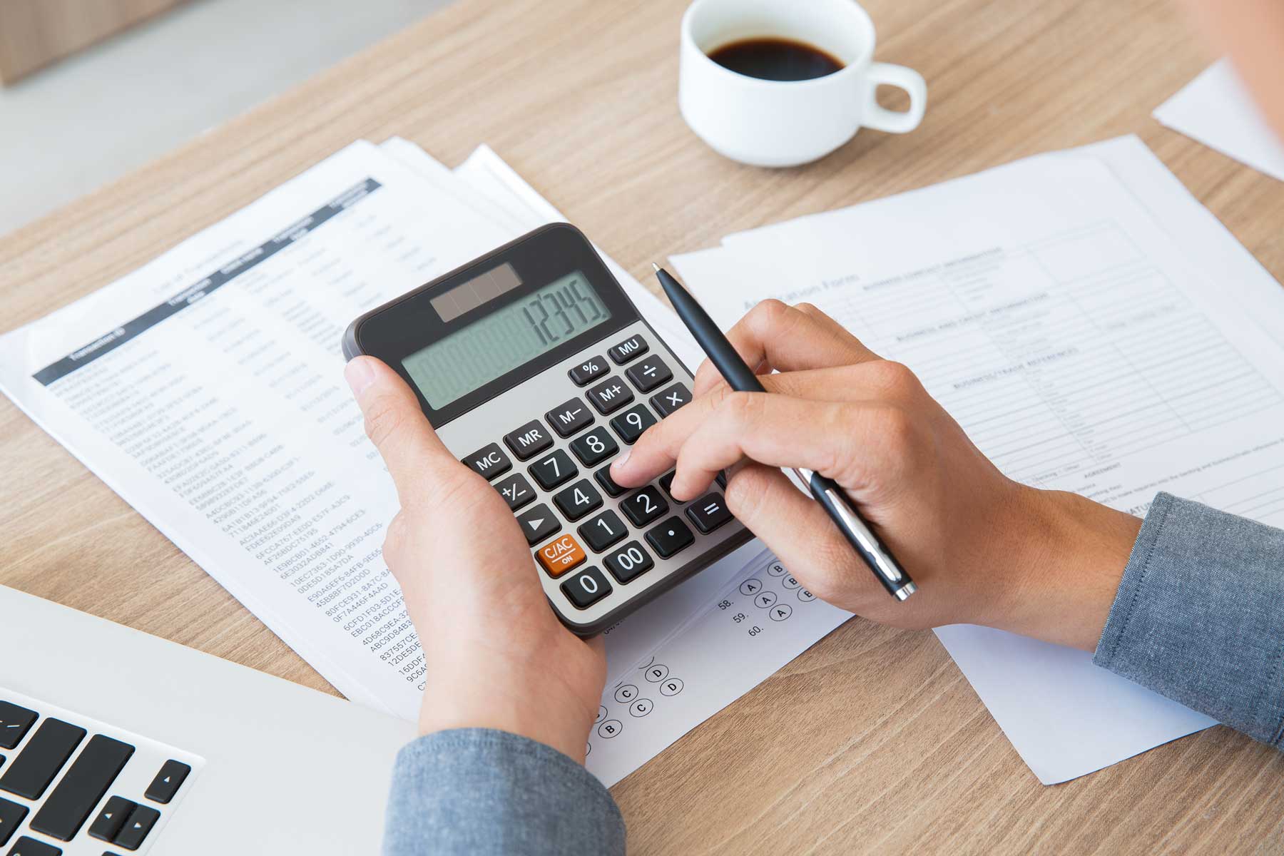 man with document and calculating financial expenses
