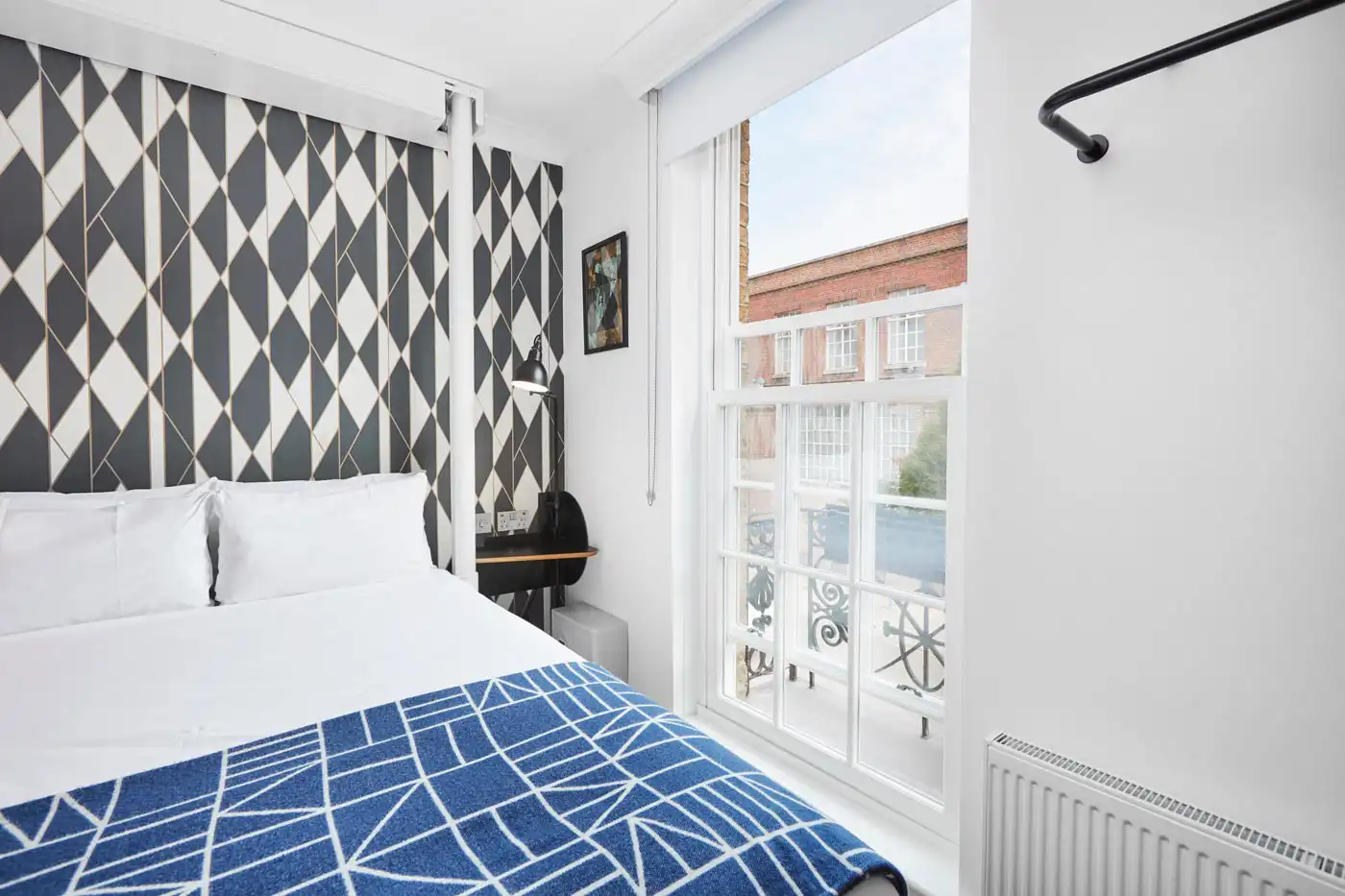 Windows and Doors of a beautiful room with bed in it